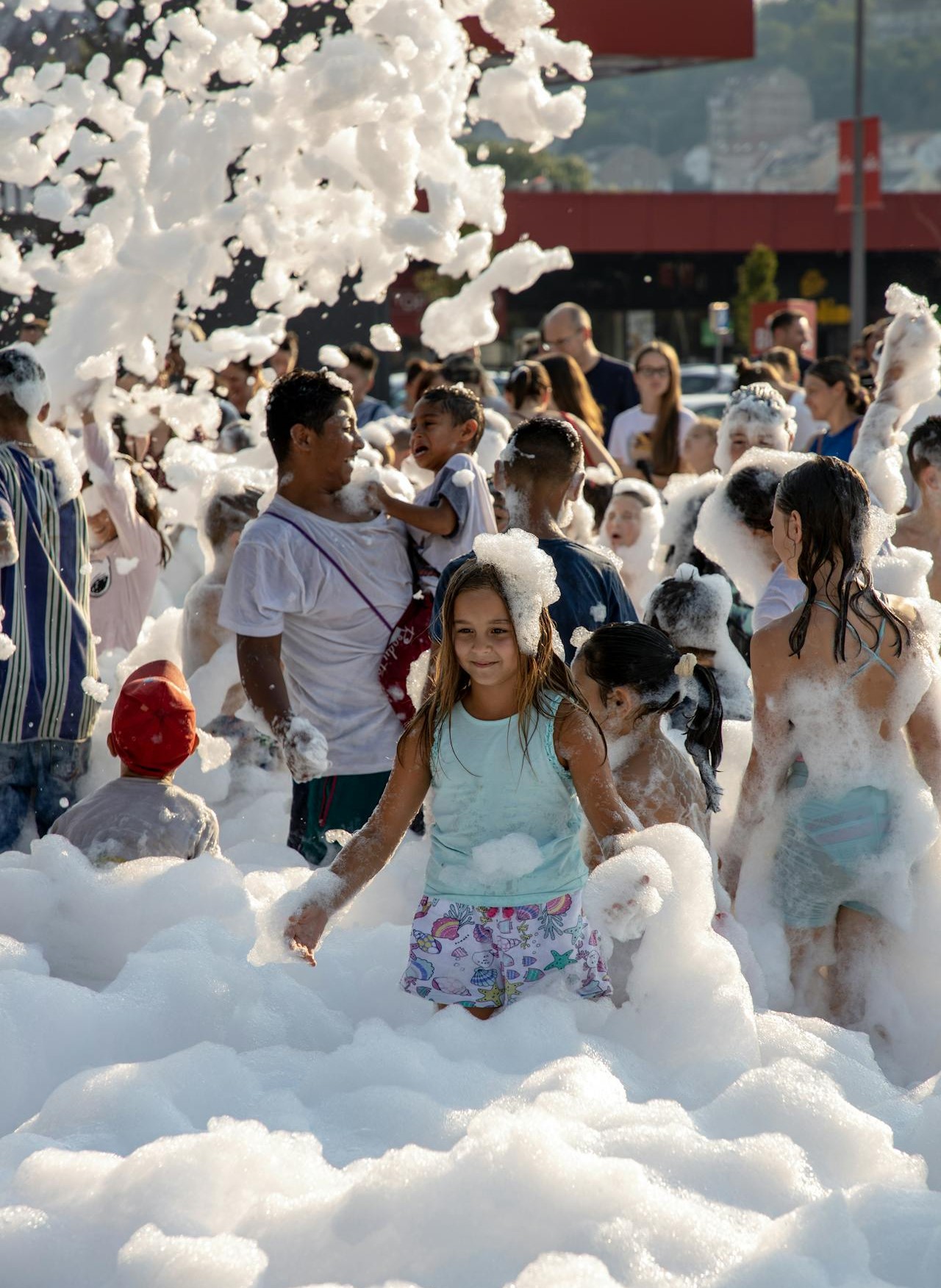 Families playing in foam